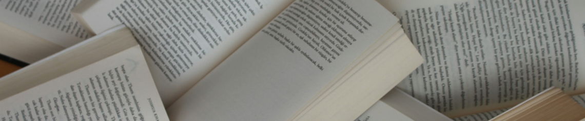 white and brown book on brown woven surface